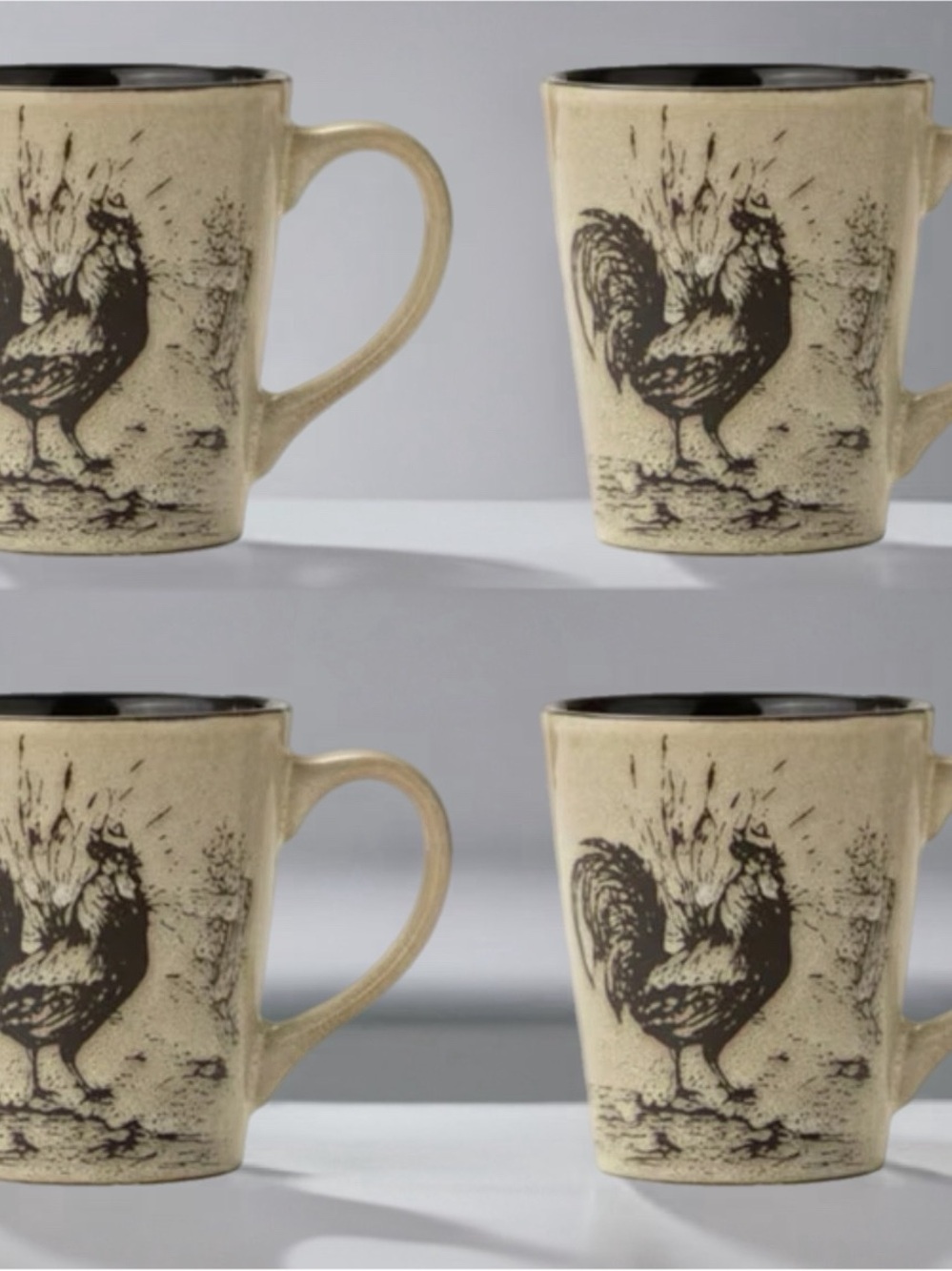 A set of four Pfaltzgraff Homespun Rooster ceramic coffee mugs. Cream and Black